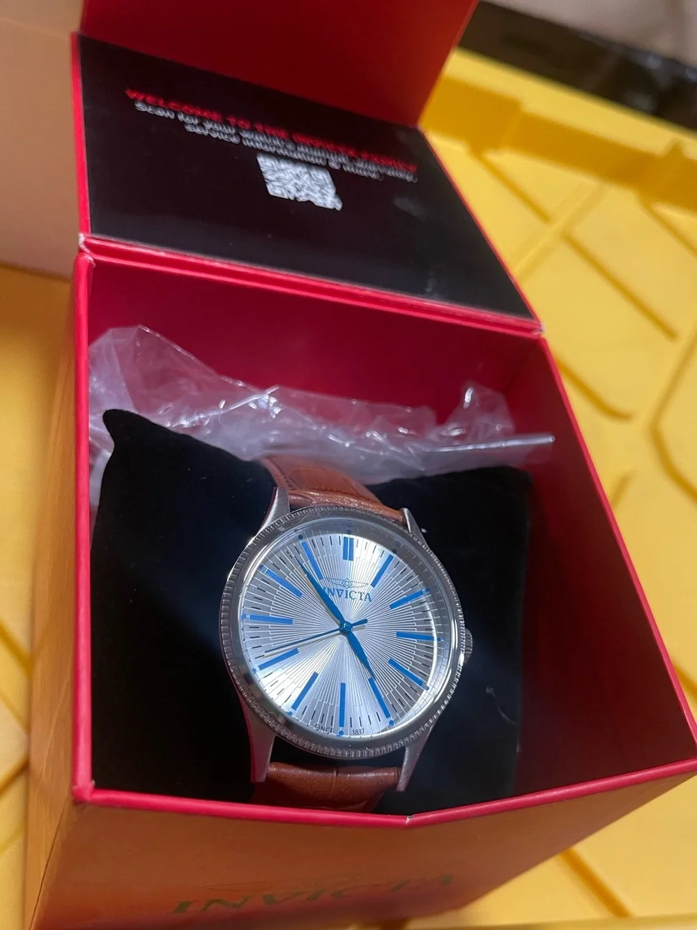 Invicta Silver Dial Watch with Blue Accents and Brown Leather Strap